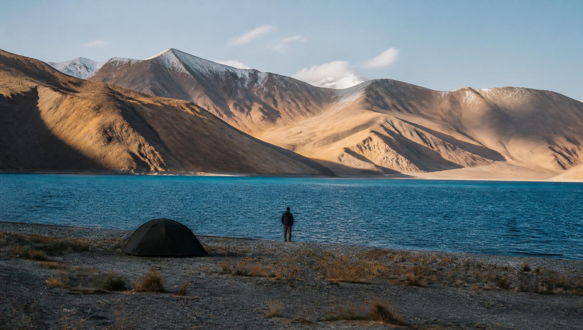 A single tent on the shore of Pangong Tso in Ladakh at first light